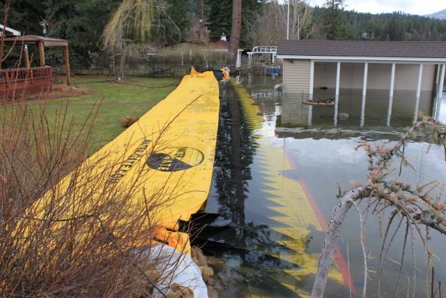 Flood wall defending a home