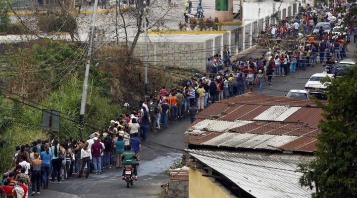 Venezuelans waiting in line for their food rations