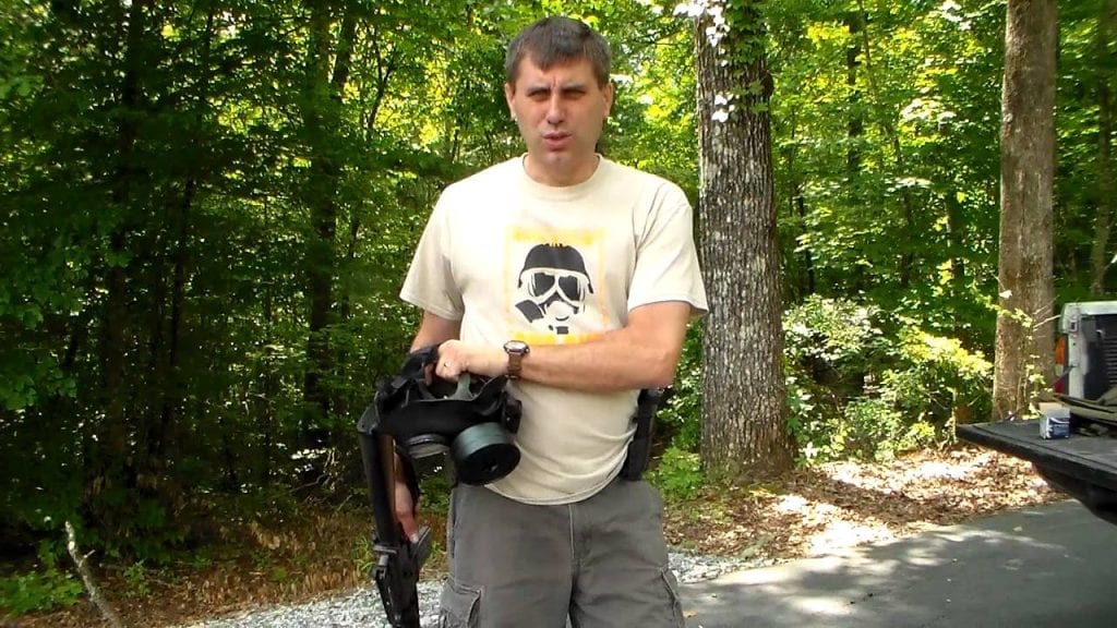 A prepper bringing a camera in the forest