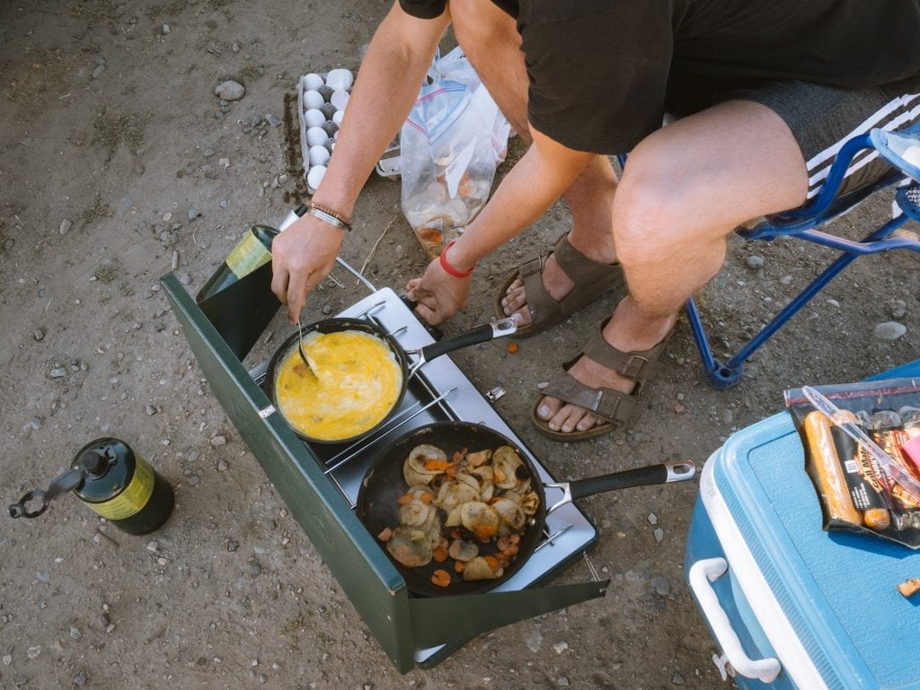 Person frying on a camping stove