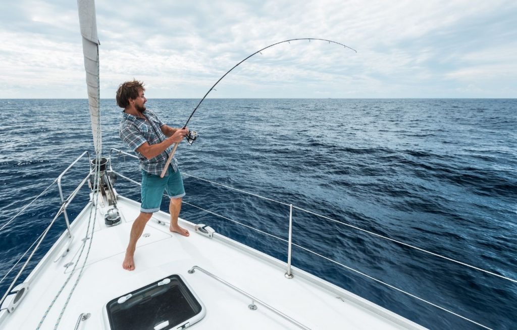 getting a fish in the ocean riding a yacht 