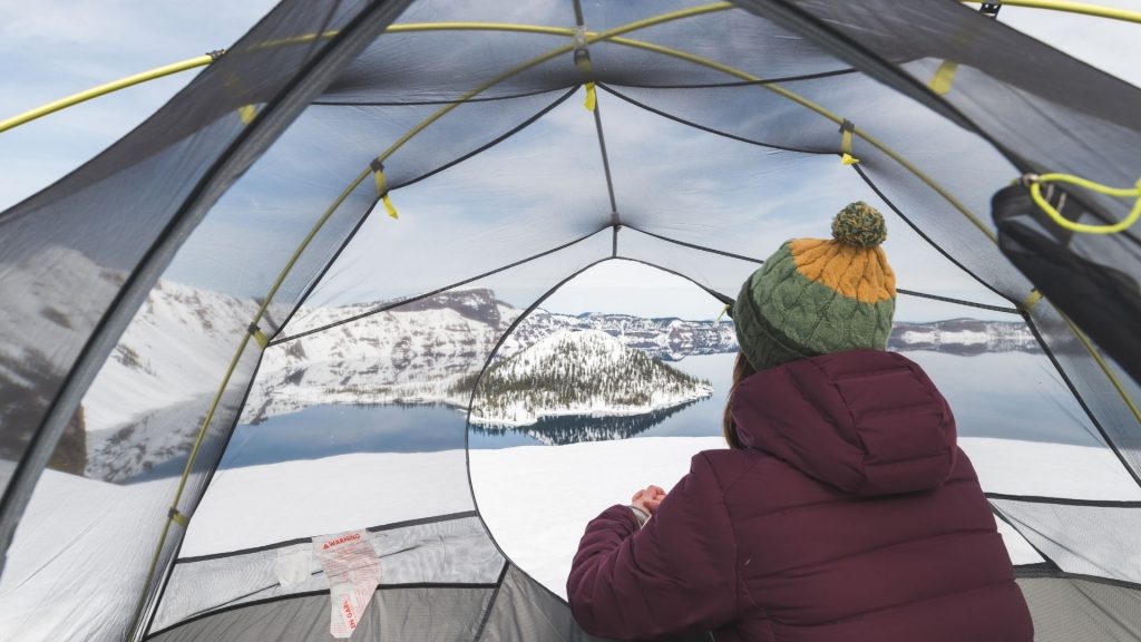 man sitting on a tent