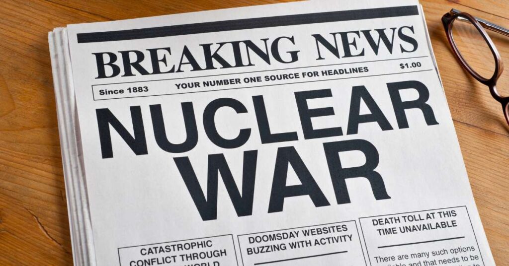 A photo of a newspaper and the breaking news headline reads "NUCLEAR WAR." 