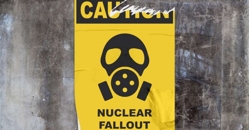 A yellow poster on a wall that reads "NUCLEAR FALLOUT" where there's an image of a gas mask.