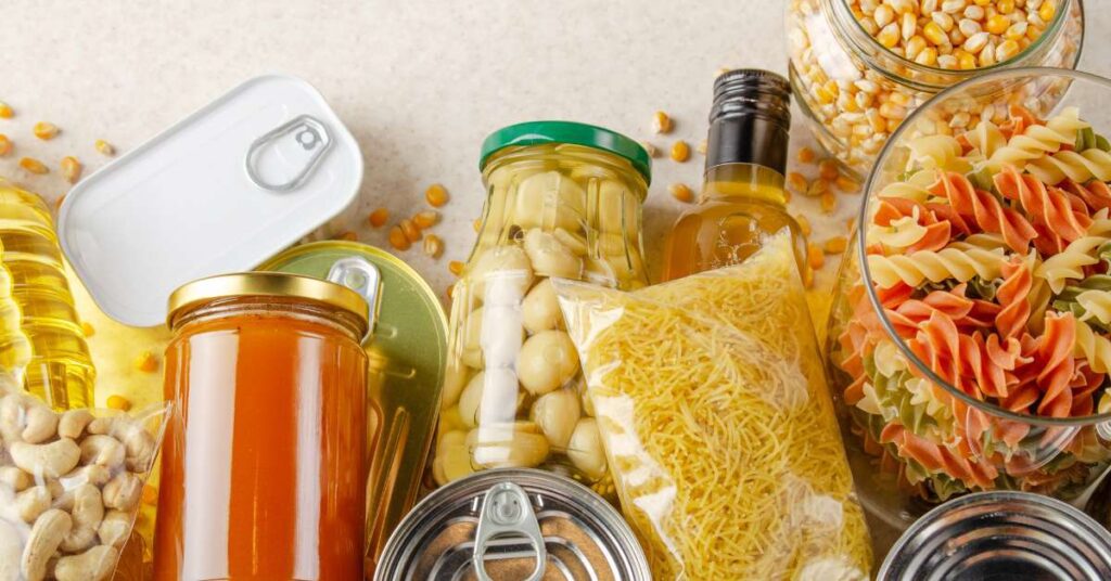 Different types of non-perishable food including canned food, pasta, beans, and more.