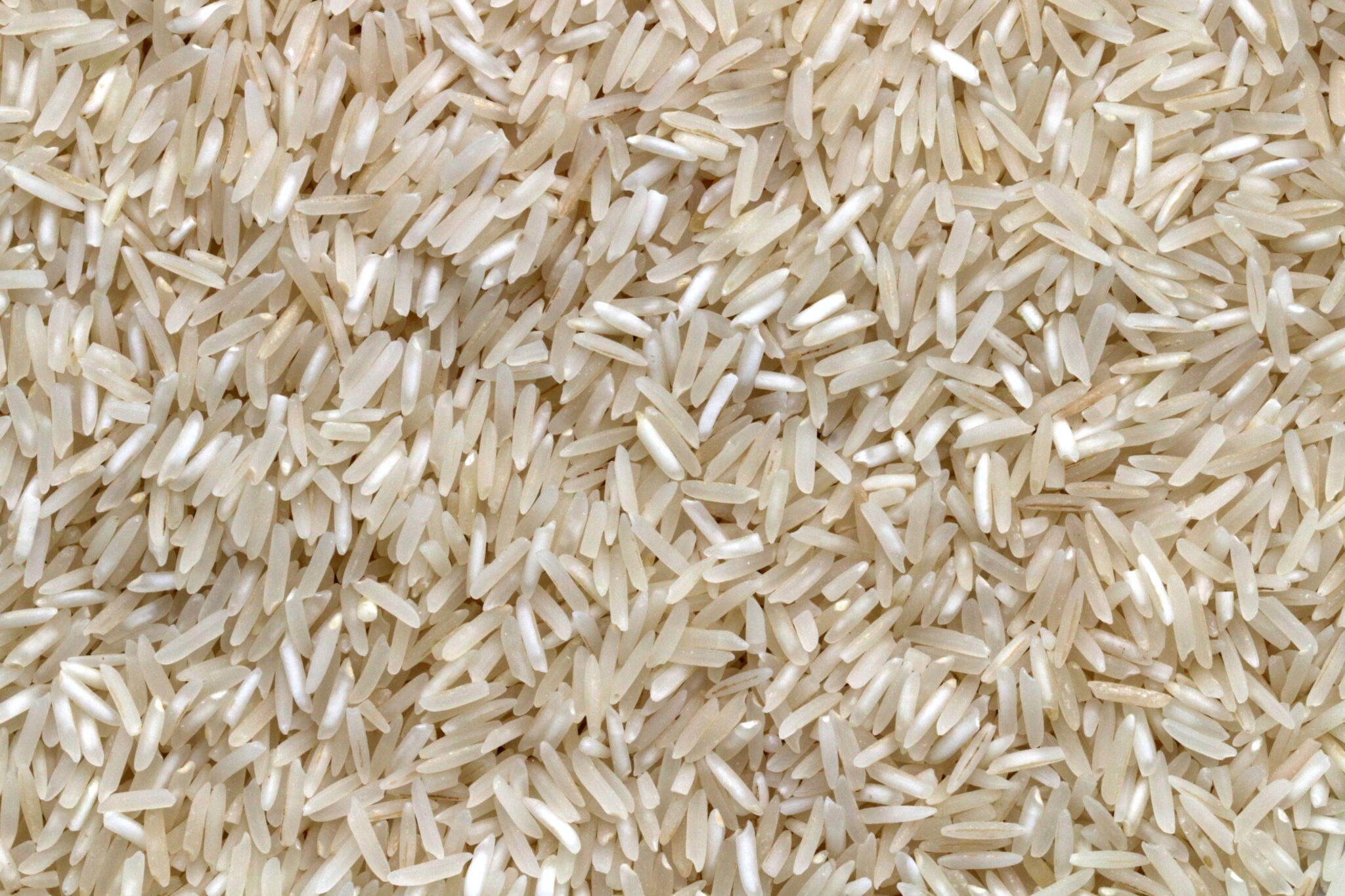 Grains of rice that is light brown in color and has a slightly translucent appearance. 