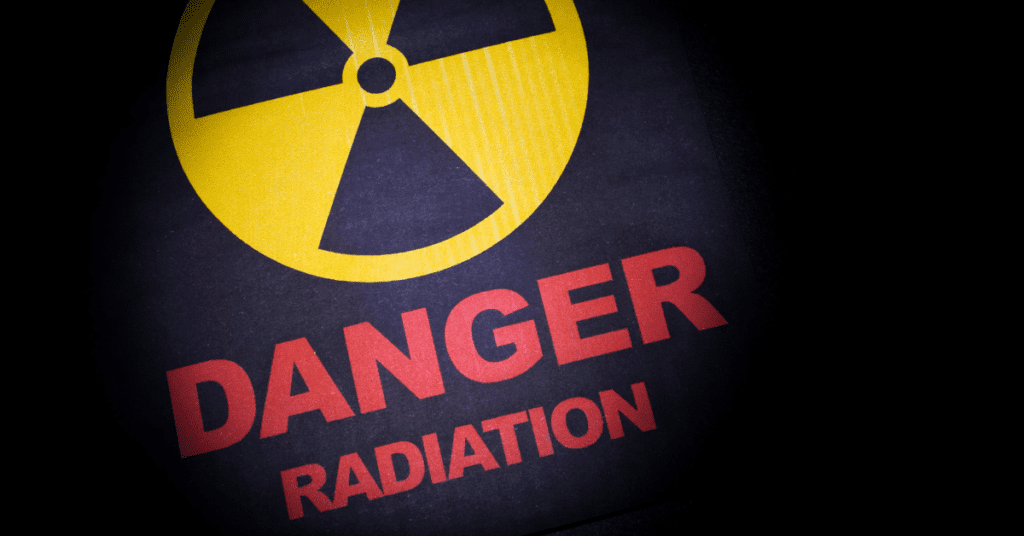 a danger sign with bold red letters indicating 'Danger. Radiation.'