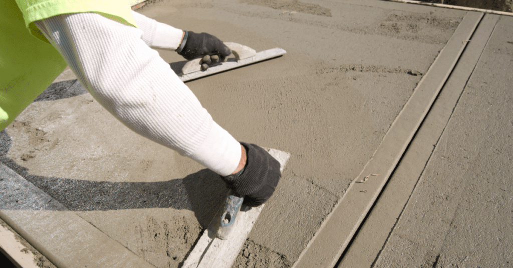 a person applying cement to a surface