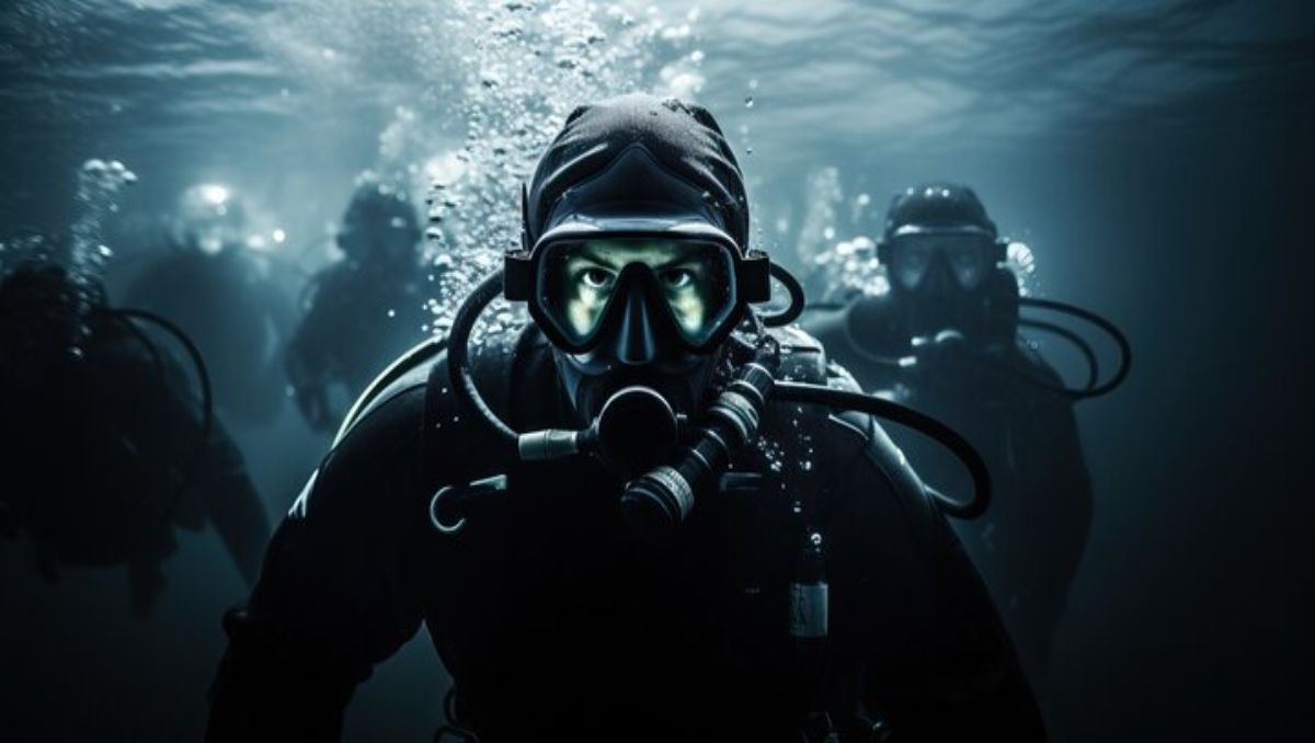 Navy SEALS wearing protective mask underwater.