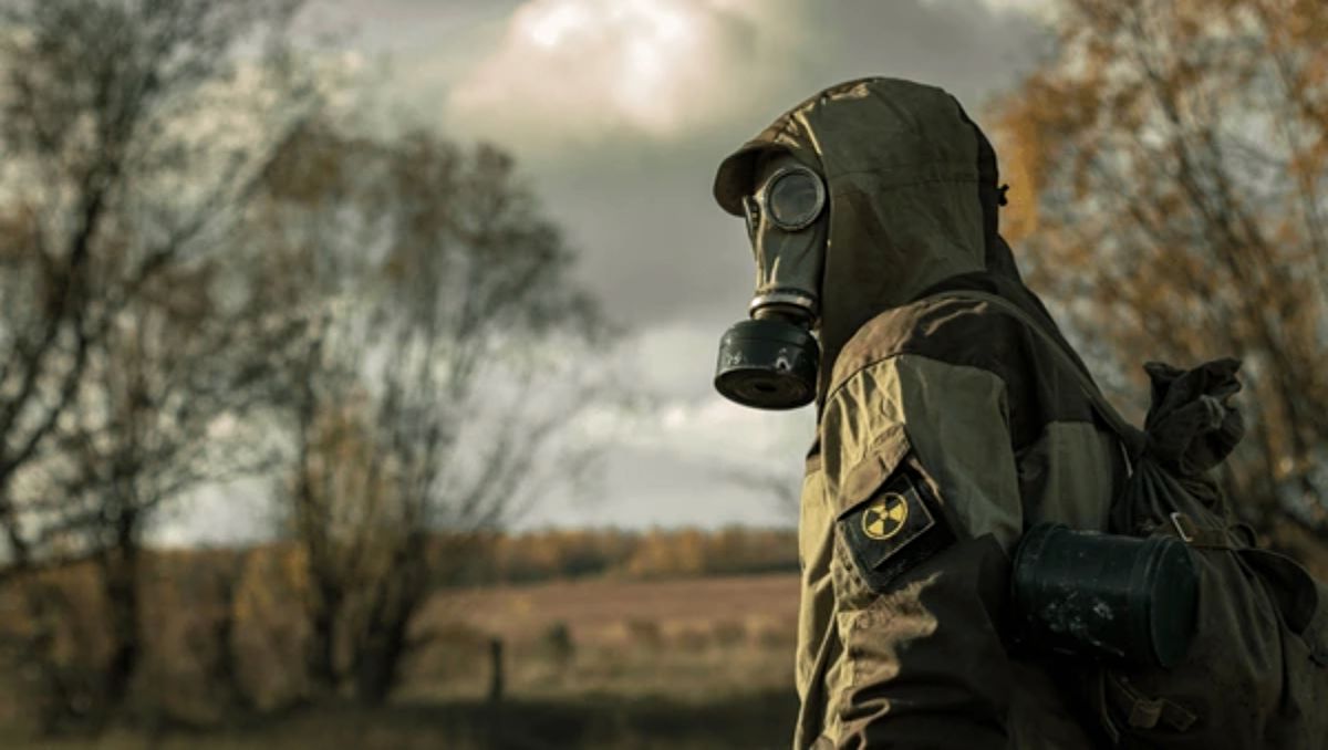 A military wearing a gas mask.