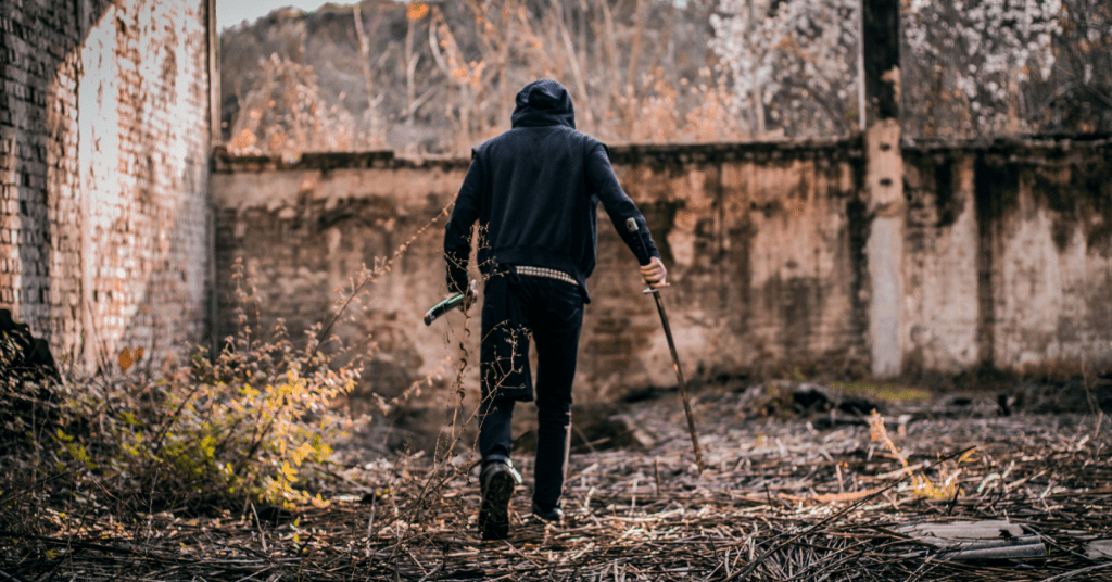 a man holding some survival gear